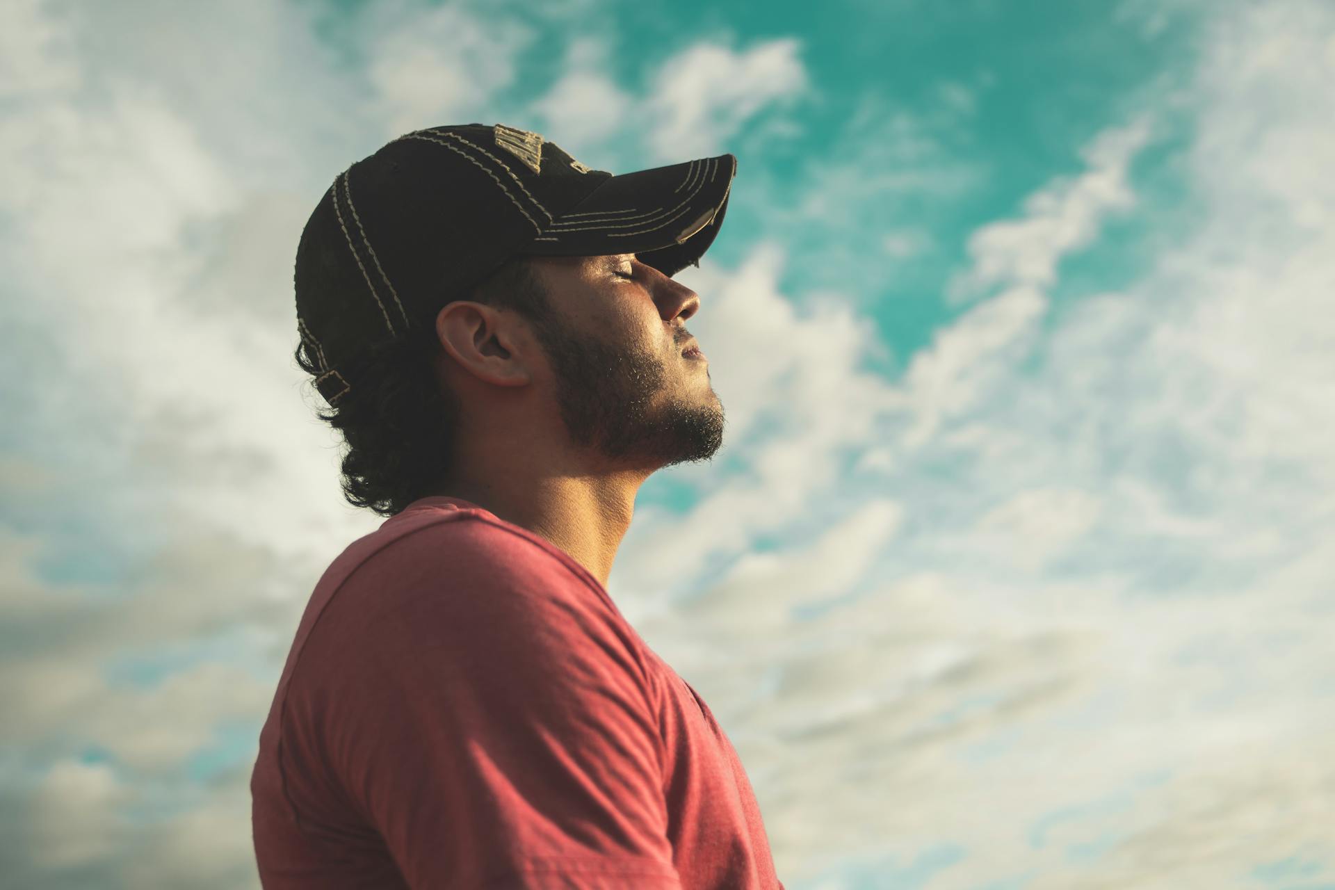 man doing breathing exercises outside
